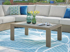 Beige rectangular outdoor coffee table with inset light top and straight legs