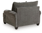 Gray chair-and-a-half with square arms, rolled cushions, and back throw pillow