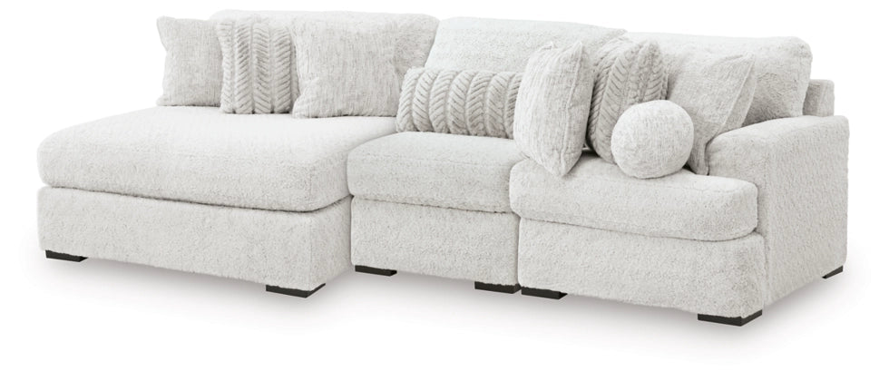 Light gray sectional sofa with armless chaise seats and round accent pillows