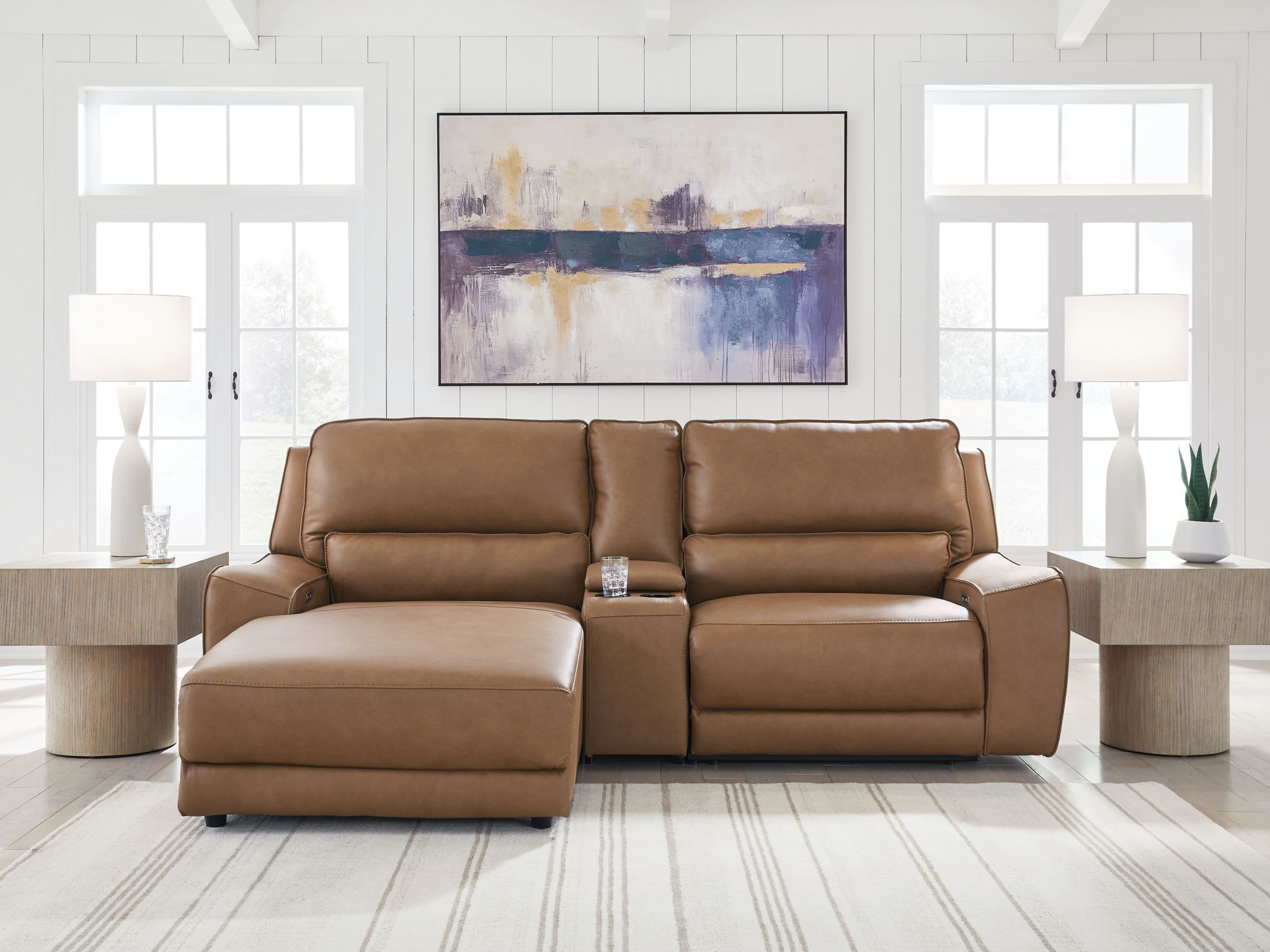Caramel power reclining sectional sofa with tufted backrest and padded armrests