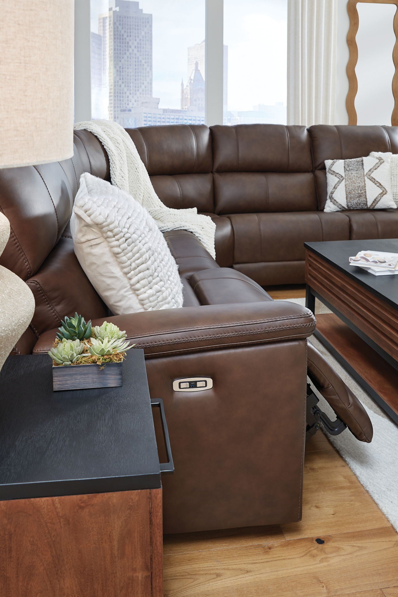 Power reclining sectional sofa in dark brown with chaise recliner and cushioned armrest
