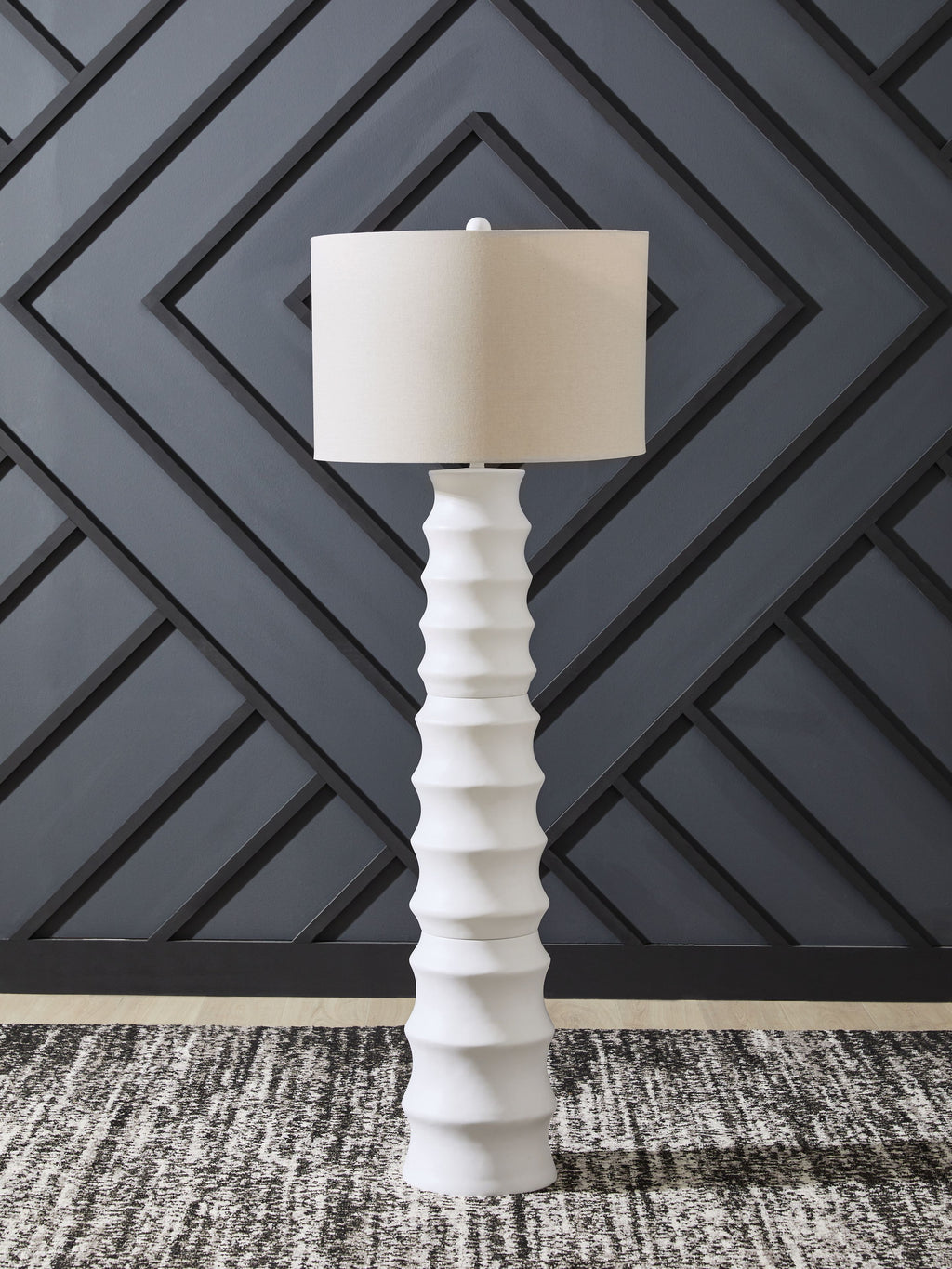 White table lamp with fabric drum shade and ridged pedestal base, full view