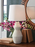 Cream table lamp with white fabric shade and speckled stone base