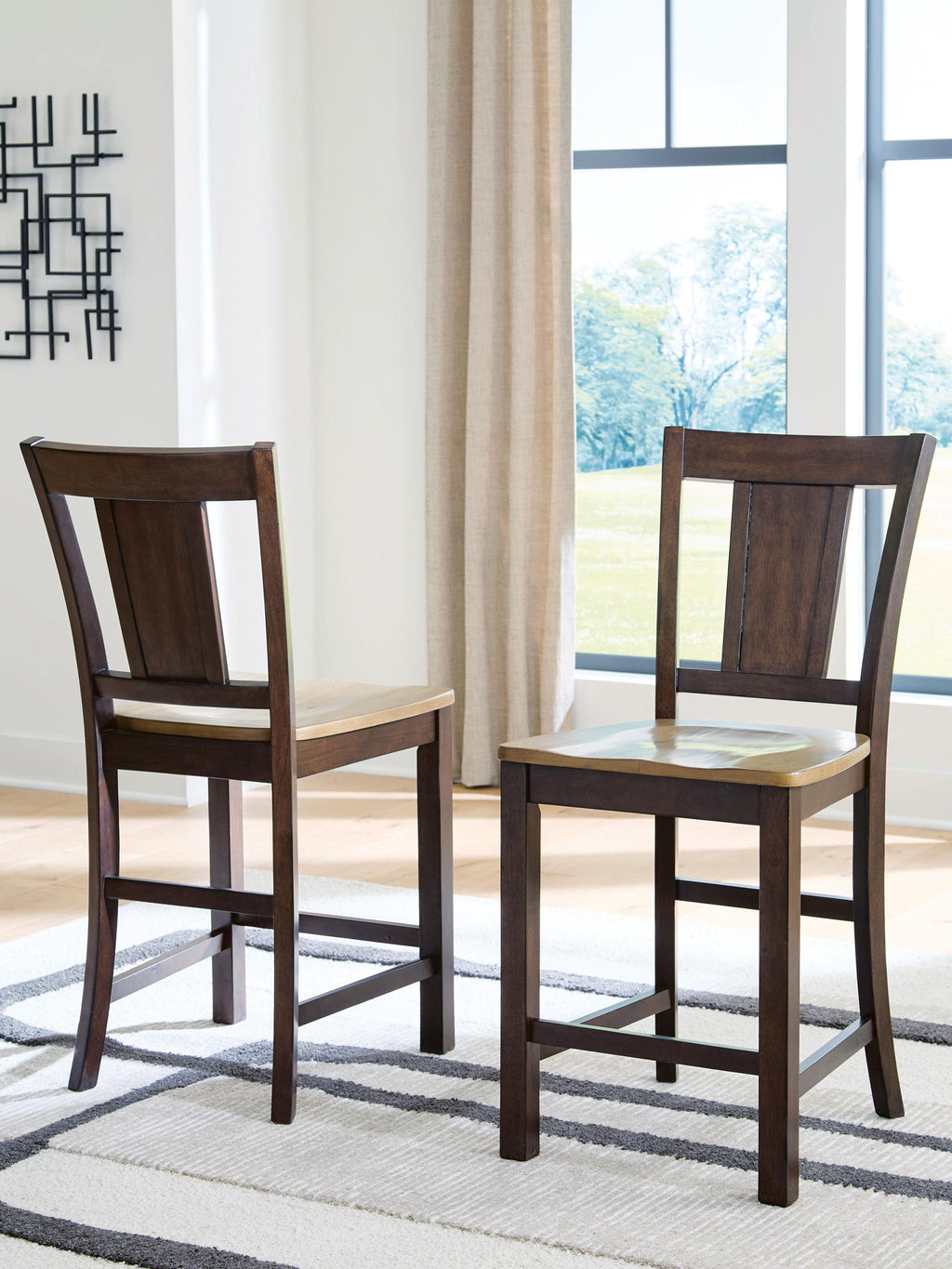 Pair of wooden barstools with dark brown backs and light brown seats, straight square legs
