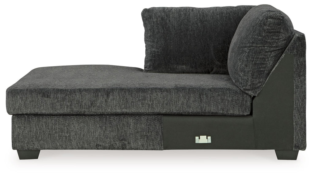Dark gray fabric corner chaise with thick seat, padded backrest, and block feet