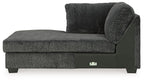 Dark gray fabric corner chaise with thick seat, padded backrest, and block feet