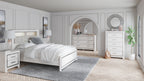 White bed headboard with tufted panel and storage shelving above