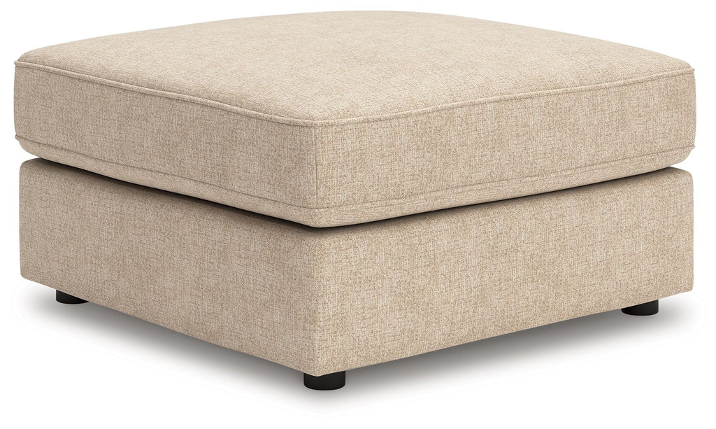 Sand upholstered ottoman with square cushion top and dark legs