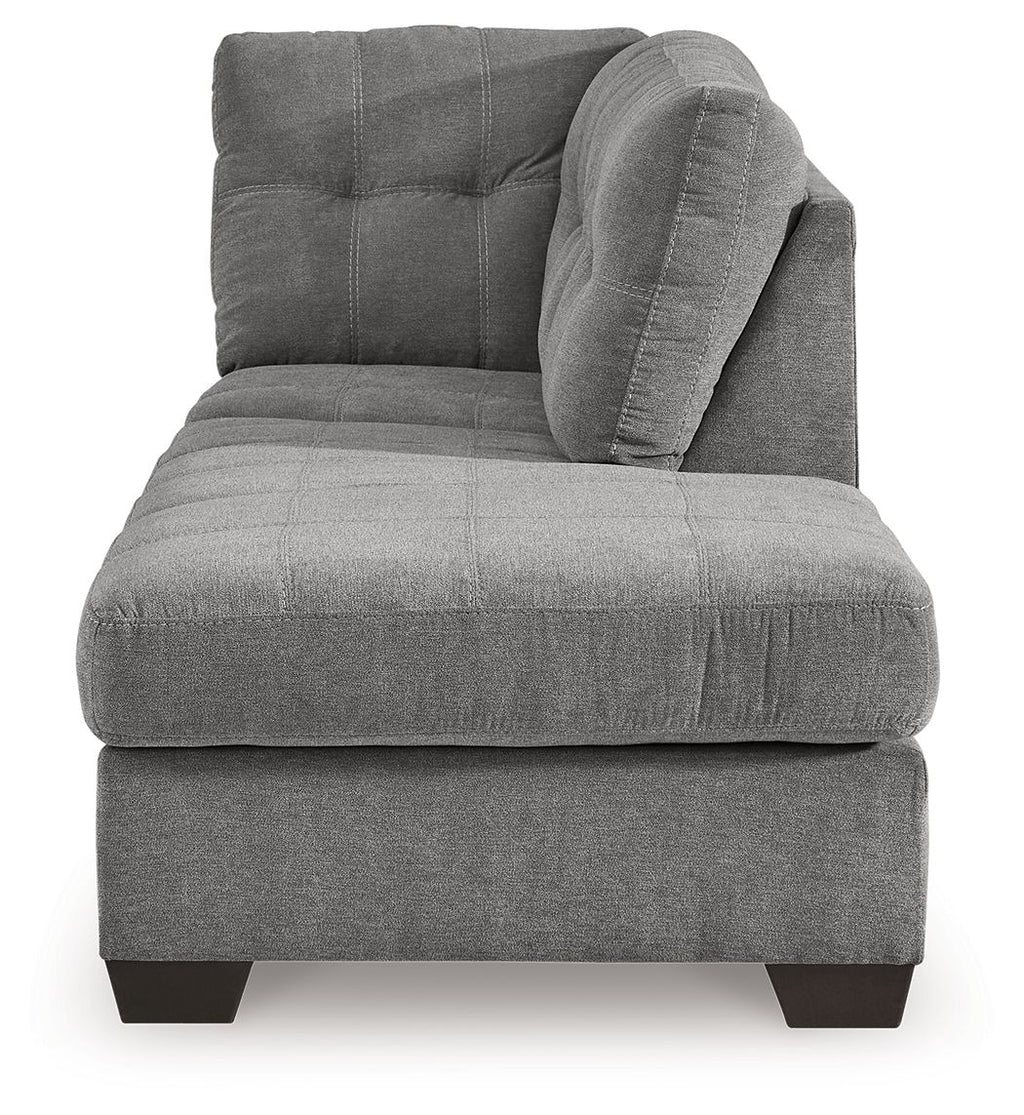 Gray fabric corner chaise with rounded tufted back and thick seat