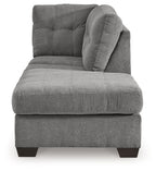 Gray fabric corner chaise with rounded tufted back and thick seat
