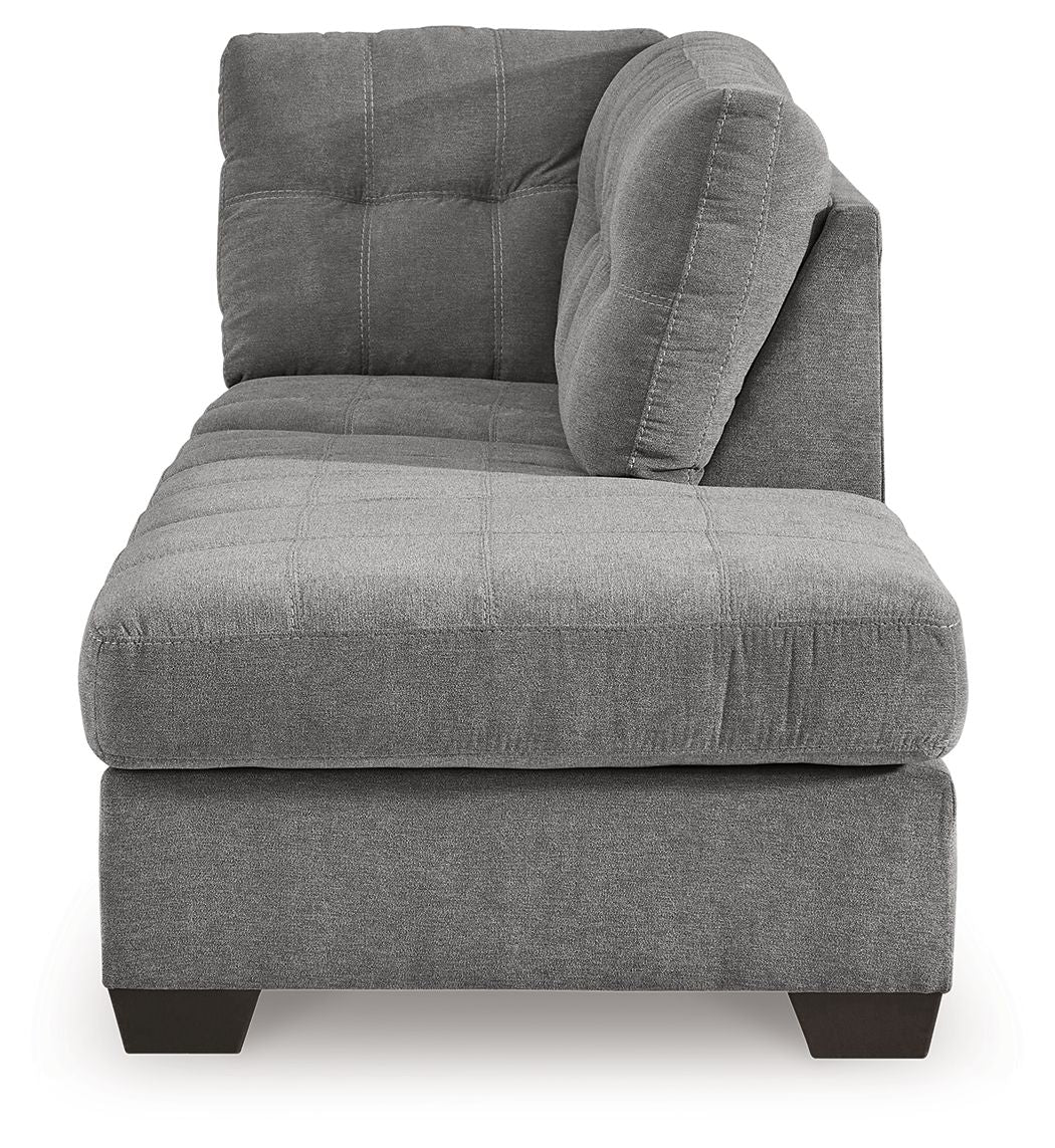 Gray fabric corner chaise with rounded tufted back and thick seat