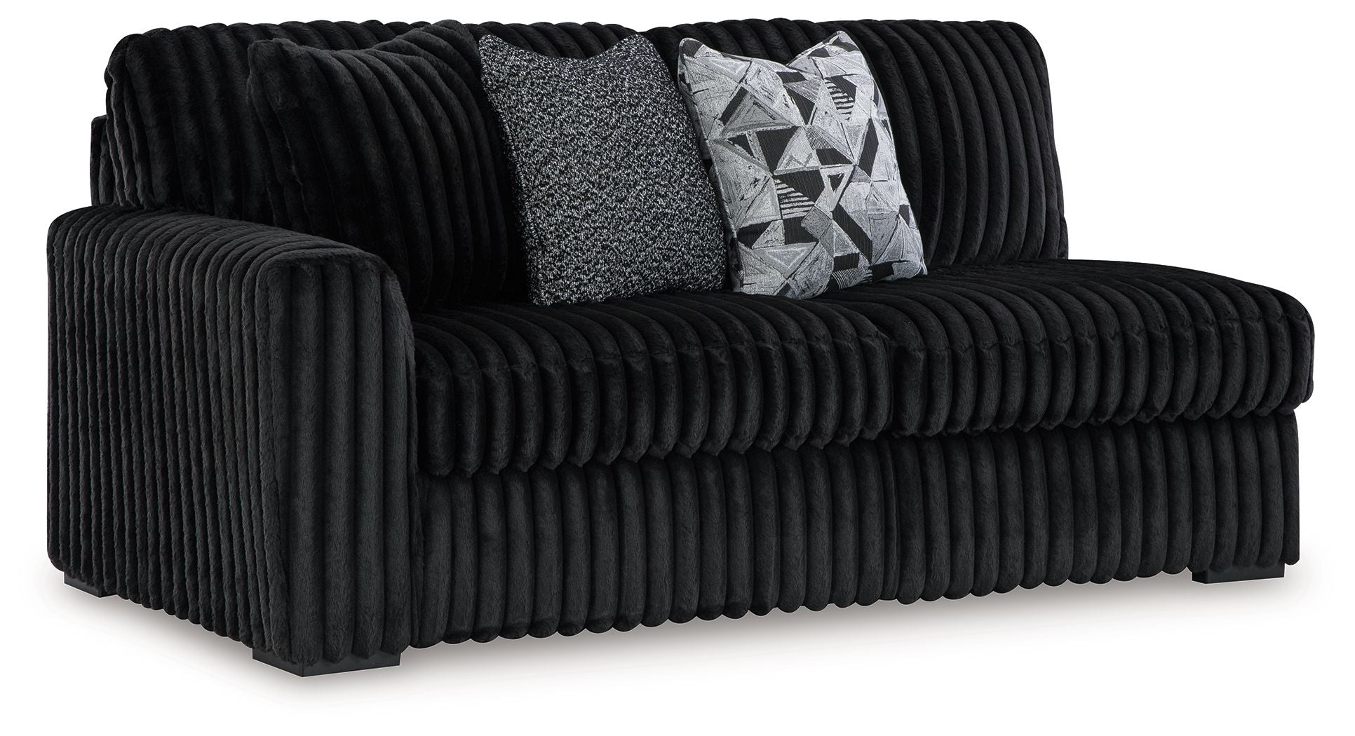 Corduroy sectional sofa in dark onyx black with ribbed arms and two throw pillows