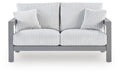 Gray loveseat with ribbed striped cushion and two matching throw pillows