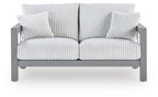 Gray loveseat with ribbed striped cushion and two matching throw pillows