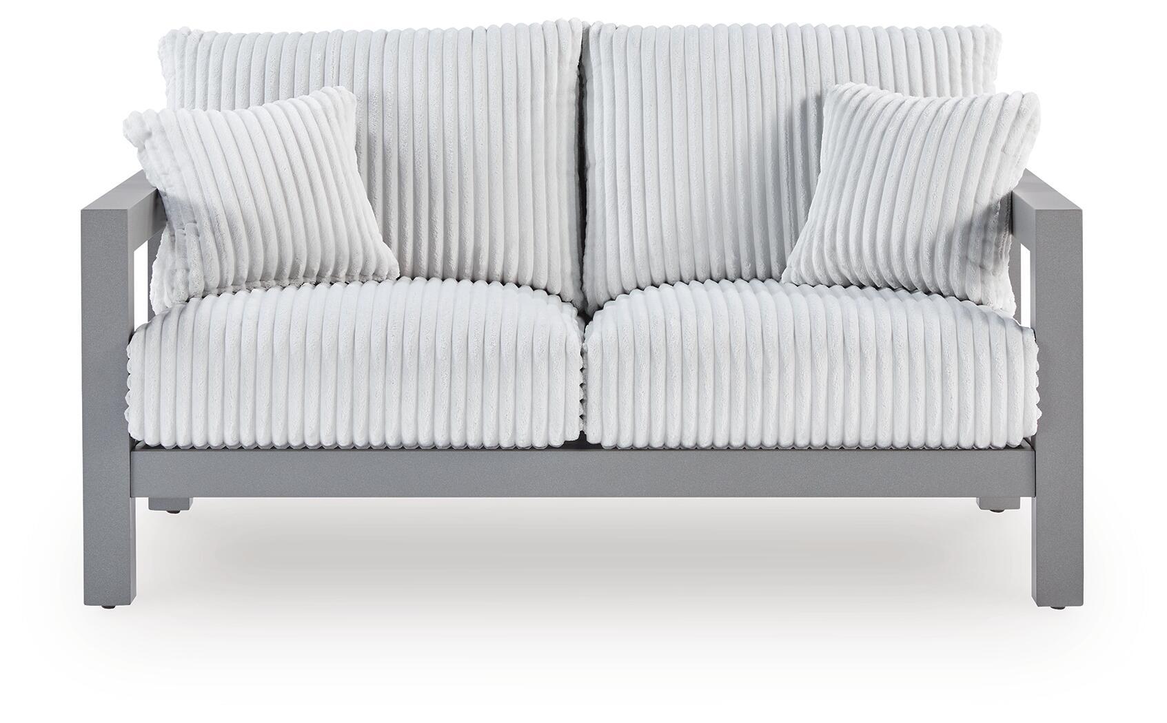 Gray loveseat with ribbed striped cushion and two matching throw pillows