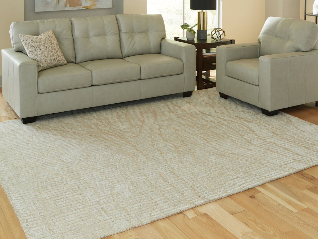 Beige patterned area rug with wavy lines and textured loop weave