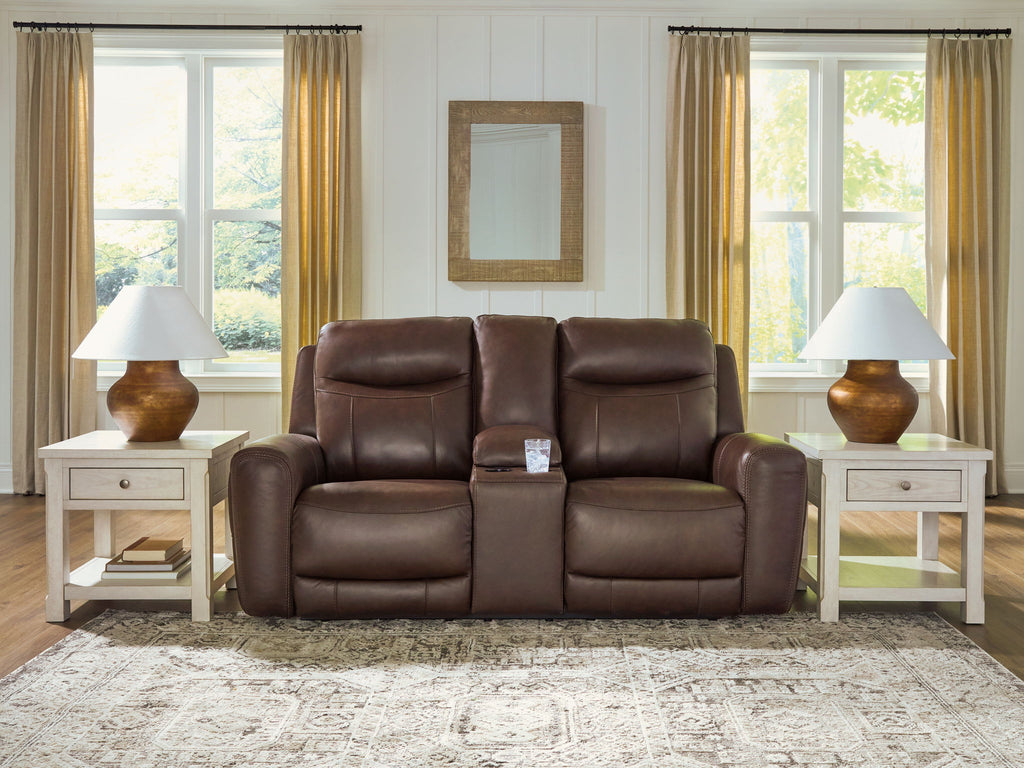 Dark brown power reclining loveseat with central console and adjustable headrests, cushioned back.
