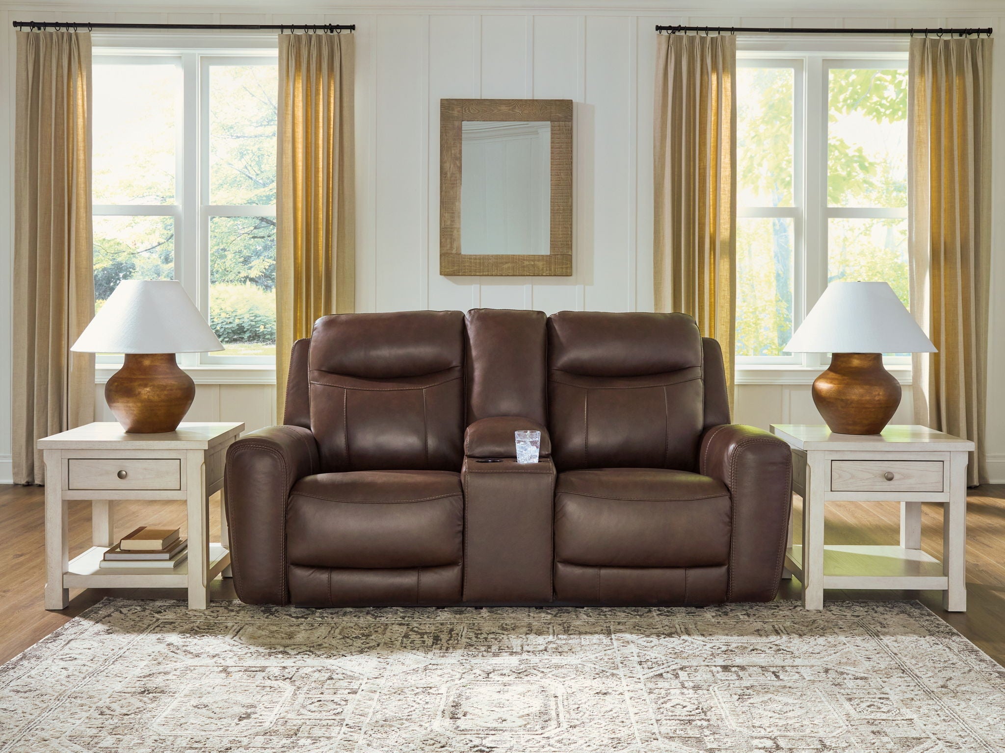 Dark brown power reclining loveseat with central console and adjustable headrests, cushioned back.