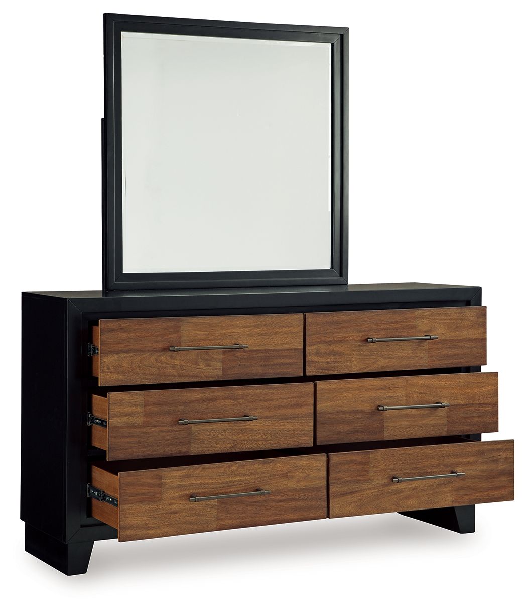 Brown wood dresser with black sides, mirror and six drawers with silver pulls