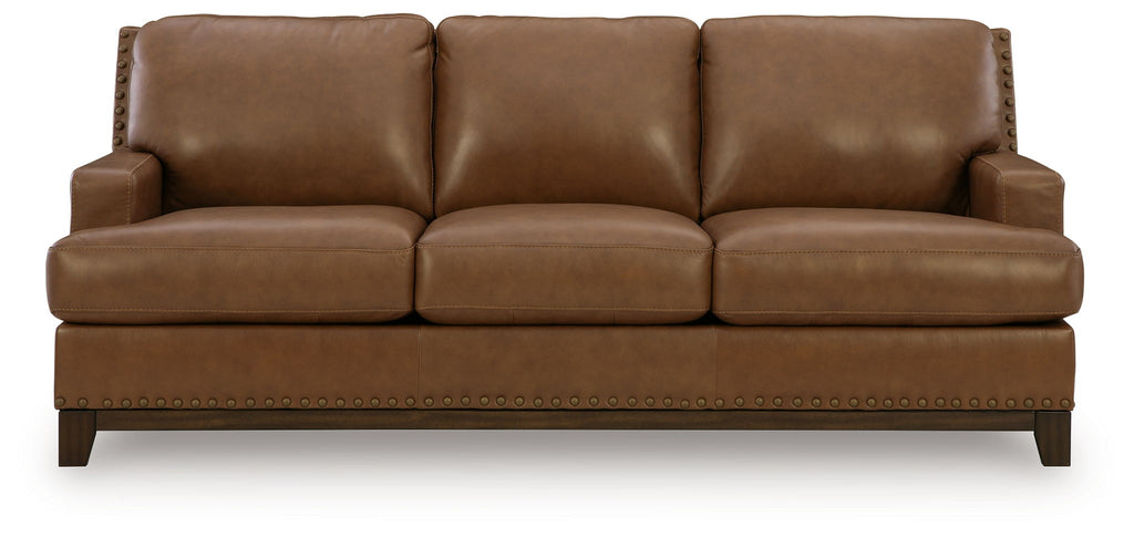 Saonara sofa in amber with three seat cushions, squared arms, and stitched skirt