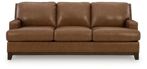 Saonara sofa in amber with three seat cushions, squared arms, and stitched skirt