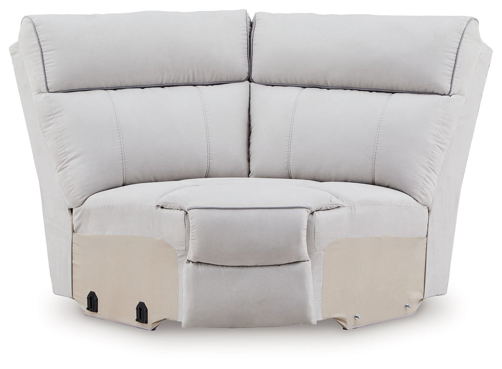 Light gray upholstered wedge sectional sofa with padded back and armrests