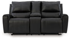 Black reclining loveseat with three seat sections and padded curved armrests