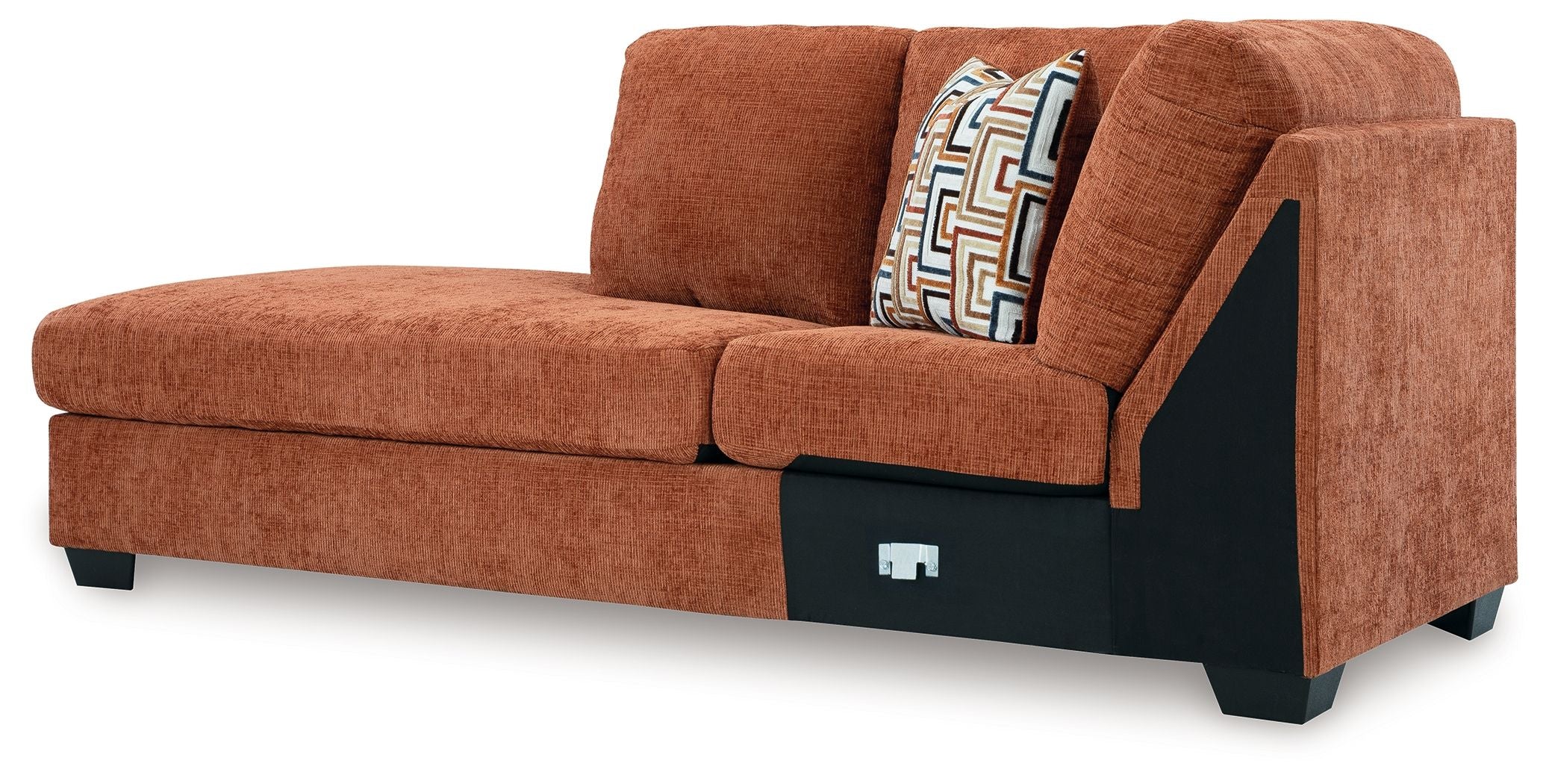 Spice brown corner chaise sofa with geometric pillow, dark base panel, and angled arm