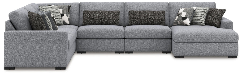 Gray sectional sofa with chaise ends and decorative patterned throw pillows