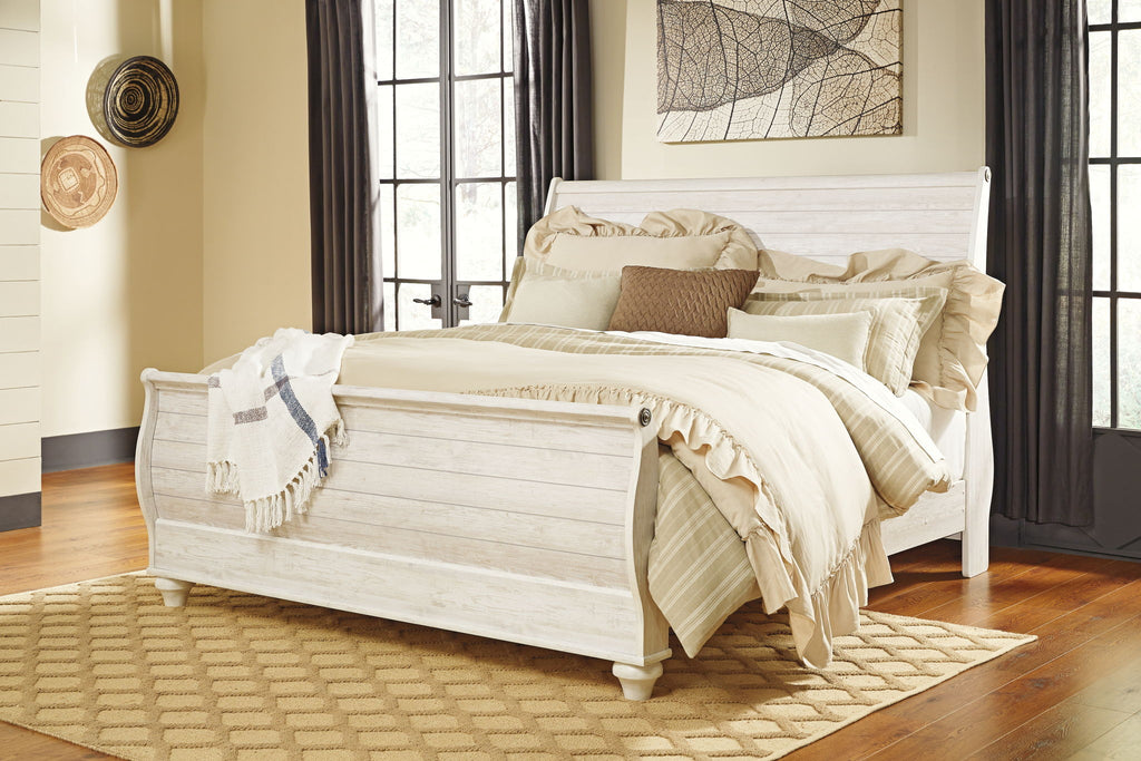 Beige sleigh bed frame with curved headboard, paneled footboard, and side rails