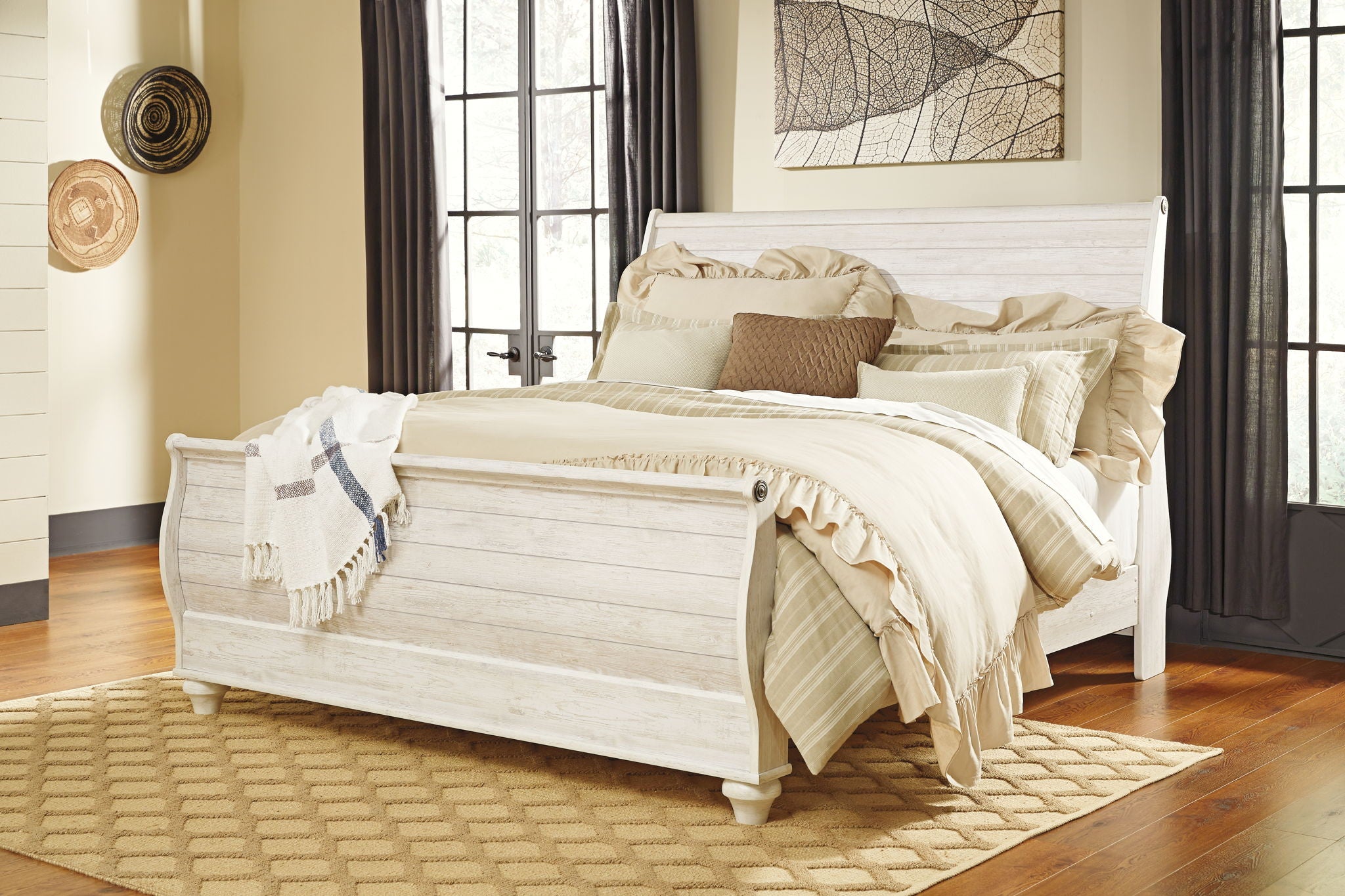Beige sleigh bed frame with curved headboard, paneled footboard, and side rails