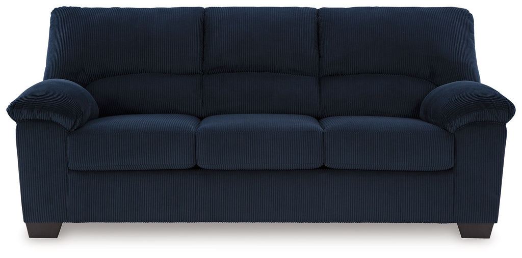Dark navy corduroy sofa with tufted back and rolled side arms