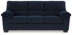 Dark navy corduroy sofa with tufted back and rolled side arms