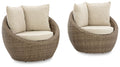 Beige woven swivel lounge chair with two seat cushions and matching back pillows