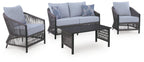 Gray outdoor lounge seating set: loveseat, two chairs, and black coffee table