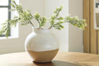 Vercott white ceramic vase with crackle glaze holding green stems on a tabletop