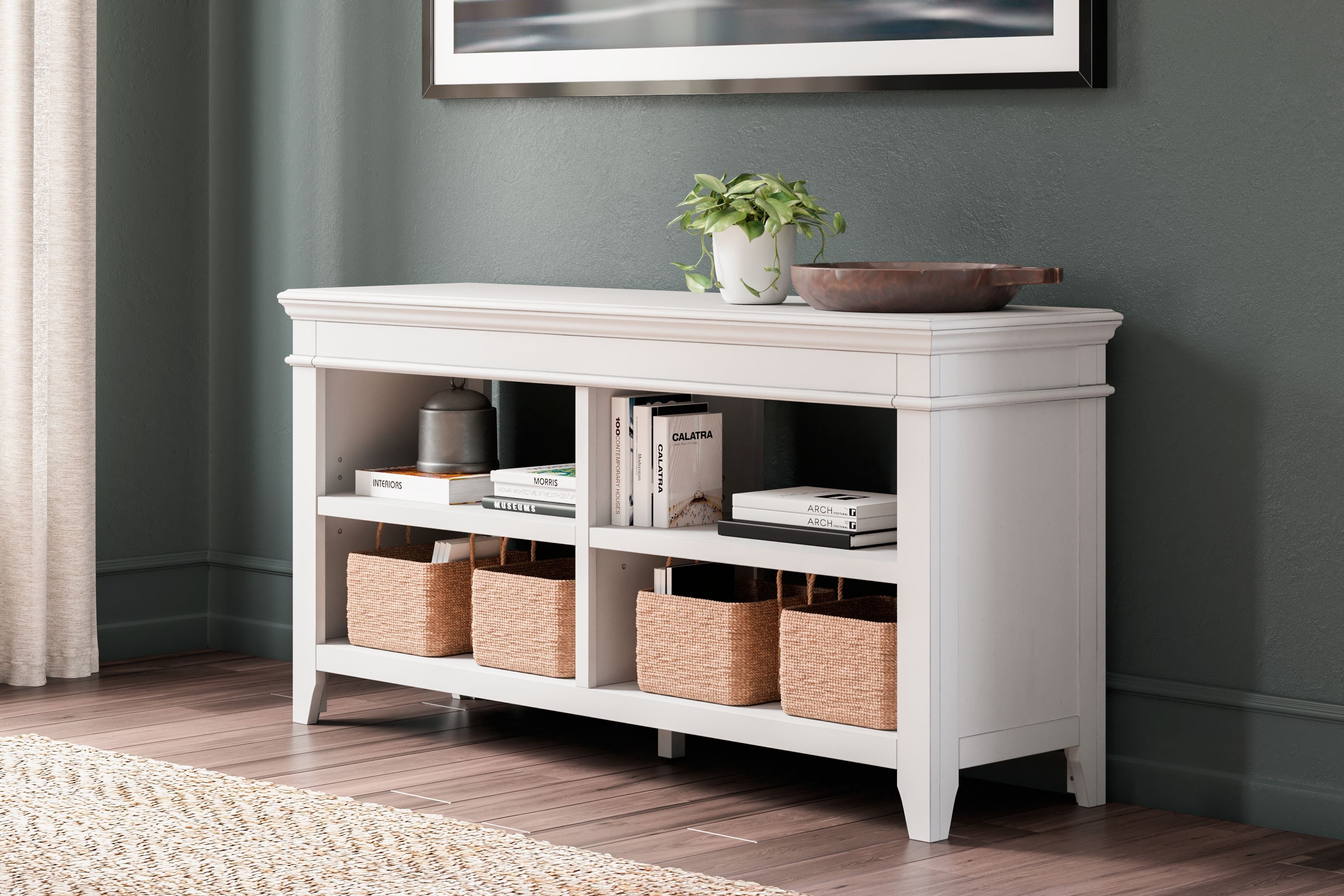 Whitewash credenza with open shelves and lower cubbies, styled with storage baskets