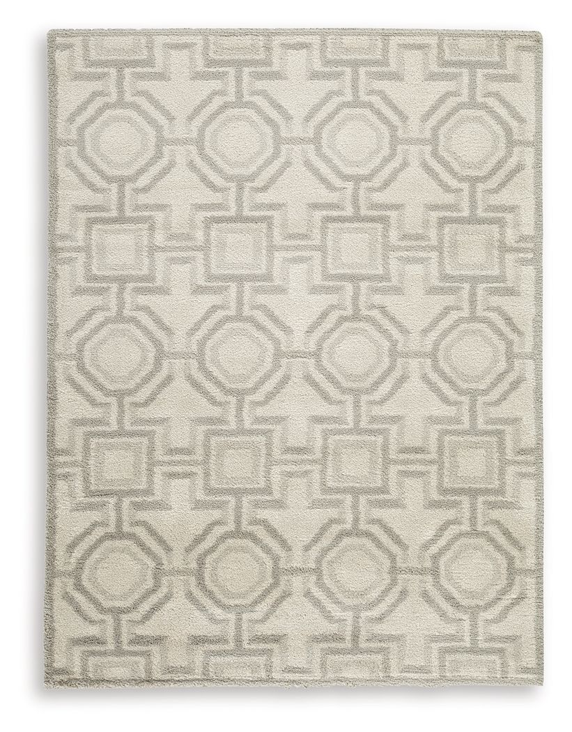 Beige rug with dense geometric motif pattern in light gray, square close-up
