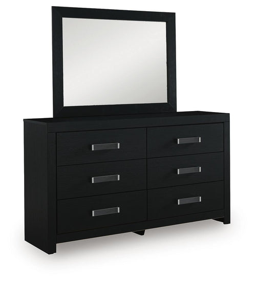 Black six-drawer dresser with attached mirror and silver bar pulls, angled view.