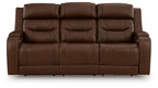 Dark brown power reclining sofa with tufted backrest and padded armrests