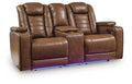 Power reclining loveseat with console, adjustable headrests, brown upholstered leather