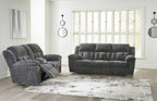 Reclining living room set with dark gray recliner sofa and matching recliner loveseat
