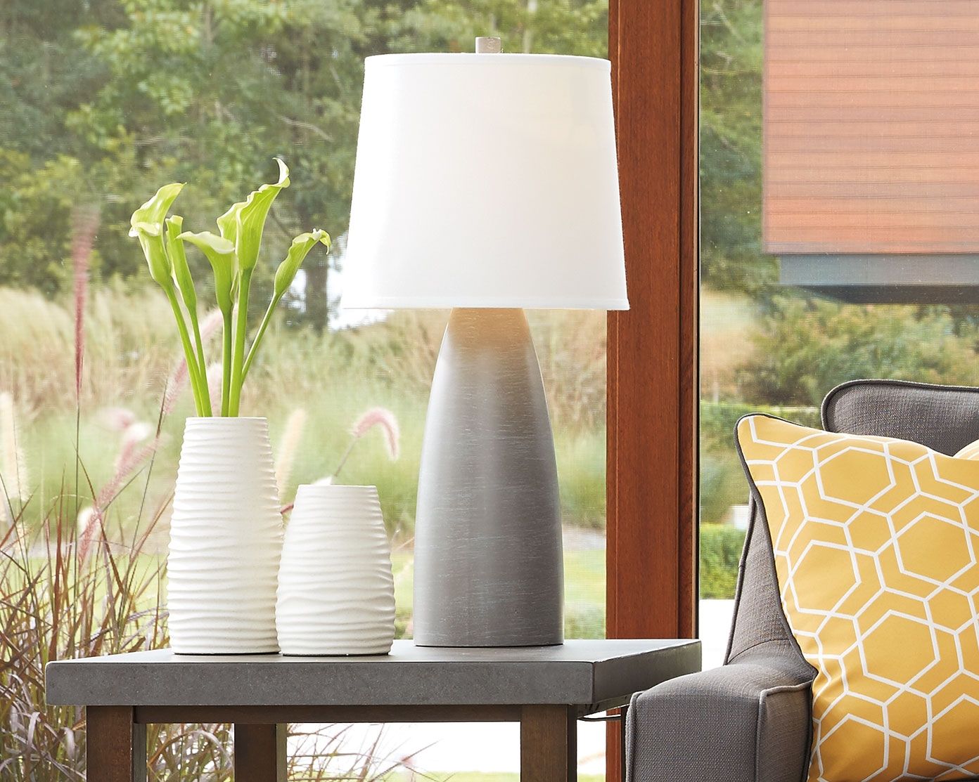 Table lamp with square white shade and dark gray textured base