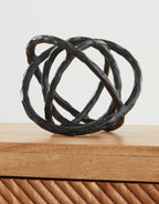 Barlee black abstract ring sculpture, interwoven loops with textured surface