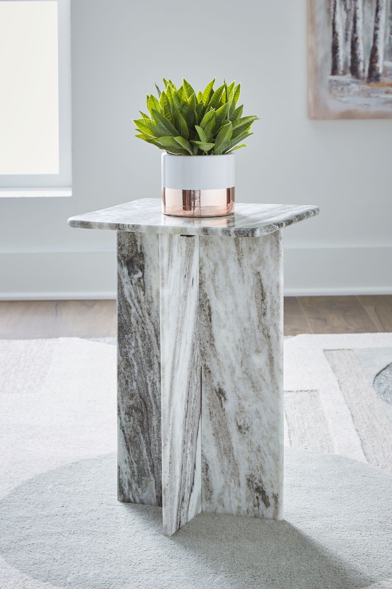 Square accent table with gray marble-look top and tapered pedestal base