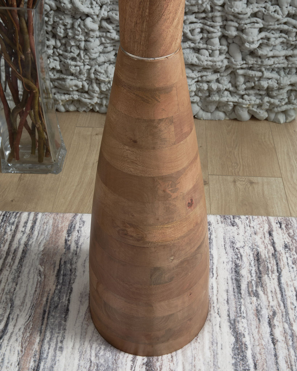 Natural brown wooden floor lamp base with stacked tapered rings and cord wrap