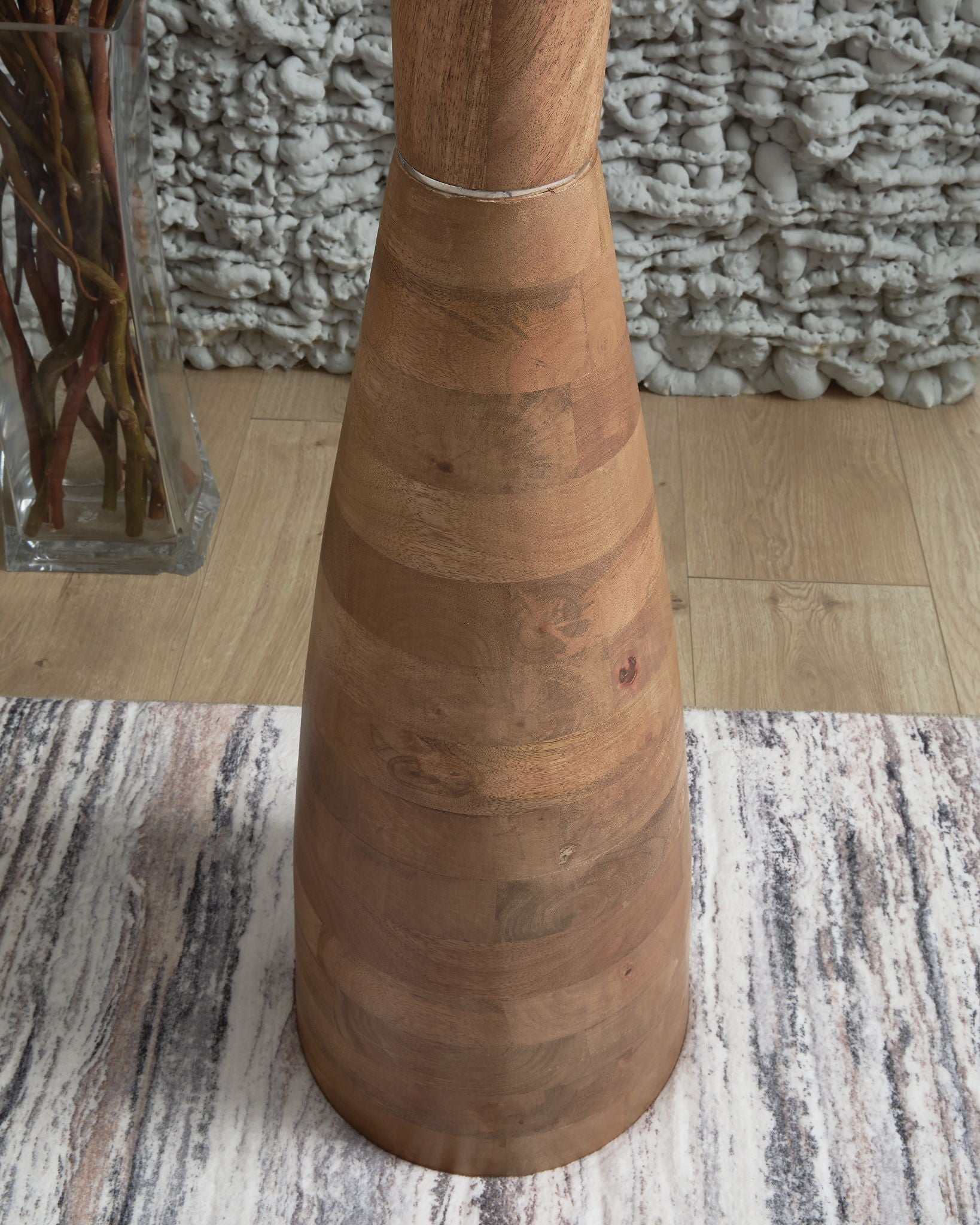 Natural brown wooden floor lamp base with stacked tapered rings and cord wrap