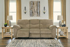 Taupe fabric sofa with three seat cushions and rolled armrests