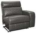 Gray power recliner chair with diamond-quilted back and padded armrests, metal base