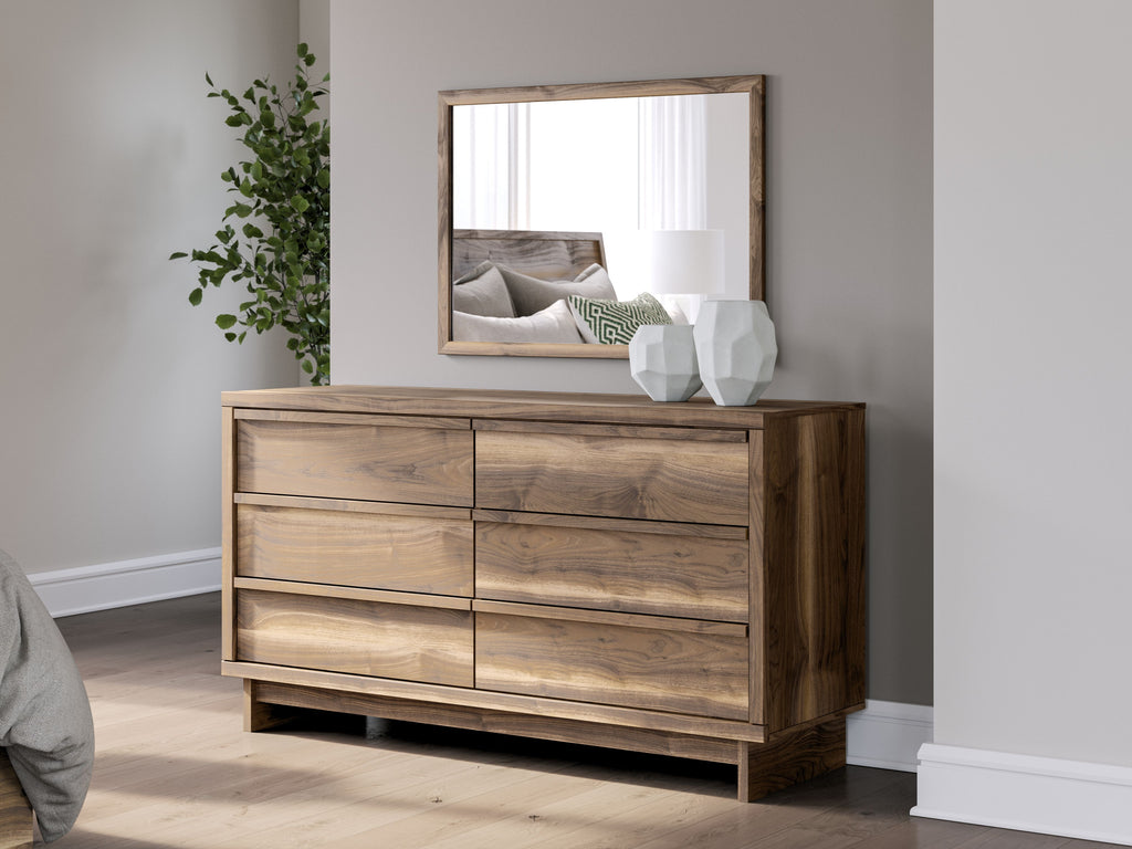 Six-drawer brown dresser with wall mirror; wood top and wide drawer fronts.